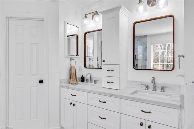 bathroom with vanity and ornamental molding