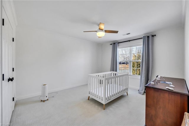 bedroom featuring ceiling fan, ornamental molding, and light carpet