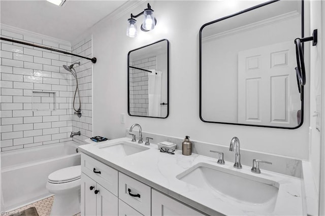 full bathroom with tiled shower / bath, ornamental molding, toilet, and vanity