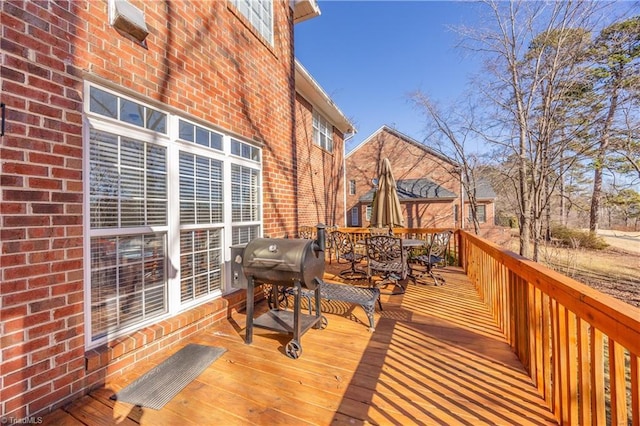 wooden deck featuring area for grilling