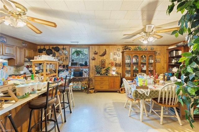 dining area with wood walls