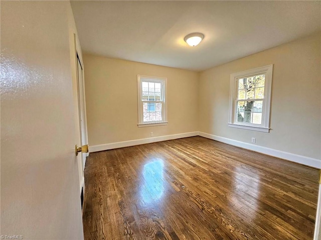 empty room featuring wood-type flooring