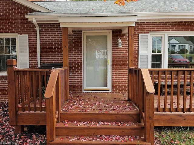 entrance to property featuring a deck