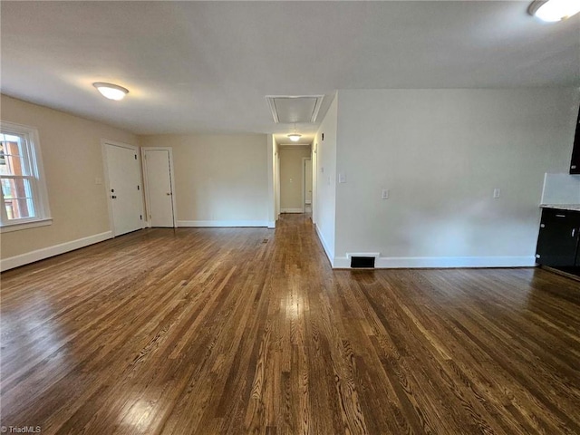 spare room with dark hardwood / wood-style flooring