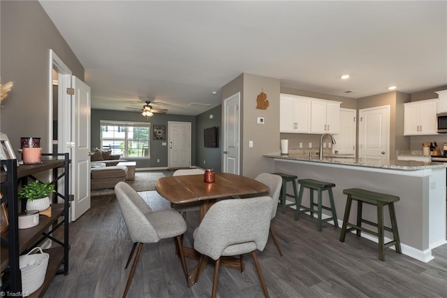 4628 Heatherly Rd, Winston-Salem, NC 27105 - dining room featuring dark wood finished floors, a ceiling fan, and recessed lighting