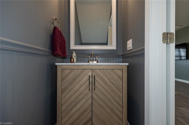 4628 Heatherly Rd, Winston-Salem, NC 27105 - bathroom with a wainscoted wall, vanity, and wood finished floors