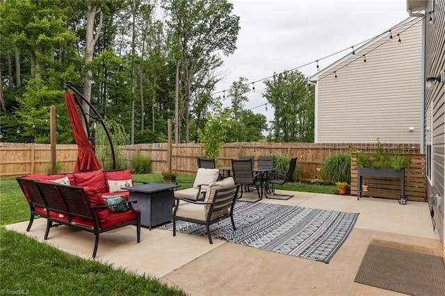 4628 Heatherly Rd, Winston-Salem, NC 27105 - fenced backyard featuring a patio area, outdoor dining space, and an outdoor hangout area