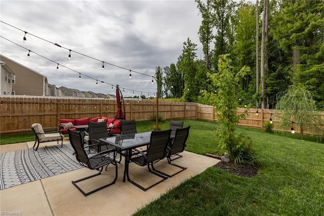 4628 Heatherly Rd, Winston-Salem, NC 27105 - fenced backyard featuring a patio area and outdoor dining area