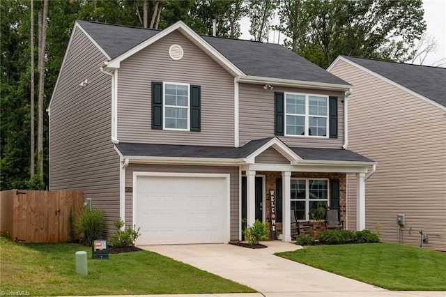 4628 Heatherly Rd, Winston-Salem, NC 27105 - view of front of home featuring a porch, a garage, and concrete driveway