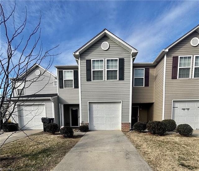 view of front of house with a front yard and a garage