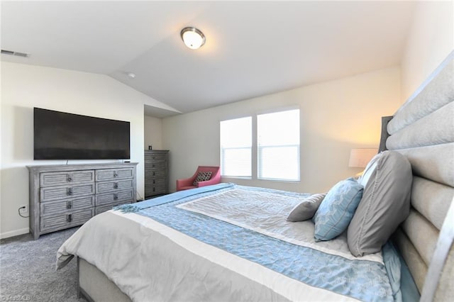 bedroom featuring vaulted ceiling and carpet floors