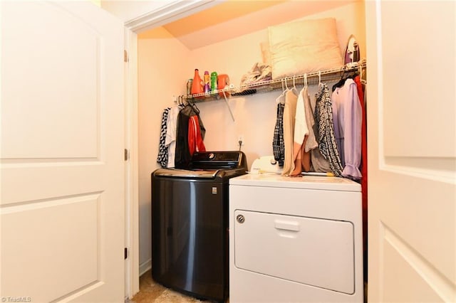 laundry area with washing machine and clothes dryer