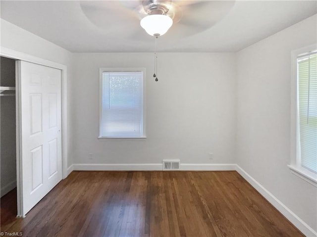 3230 High Cliffs Rd, Pfafftown, NC 27040 - unfurnished bedroom with wood finished floors, a closet, and a ceiling fan