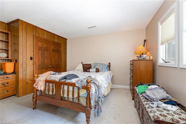 4680 Sherborne Dr, Pfafftown, NC 27040 - bedroom featuring light colored carpet and wood walls