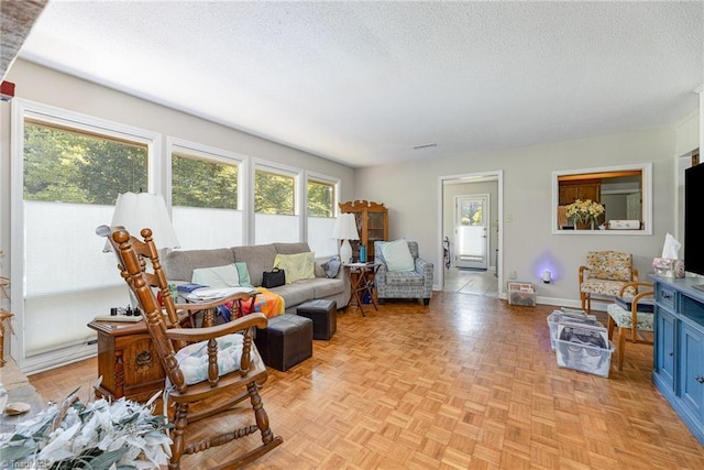 4680 Sherborne Dr, Pfafftown, NC 27040 - living room featuring a textured ceiling and baseboards
