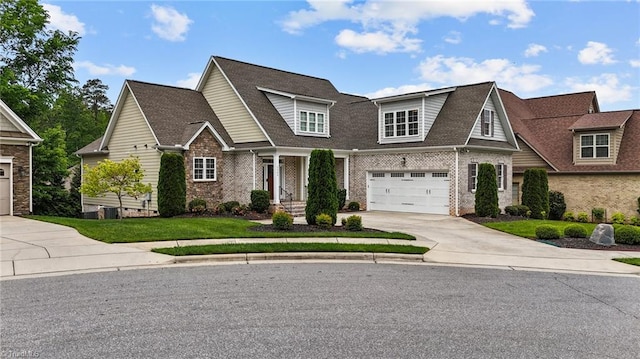 view of front of property with a garage and a front yard