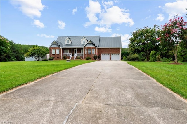 view of front of property with a garage, covered porch, and a front lawn