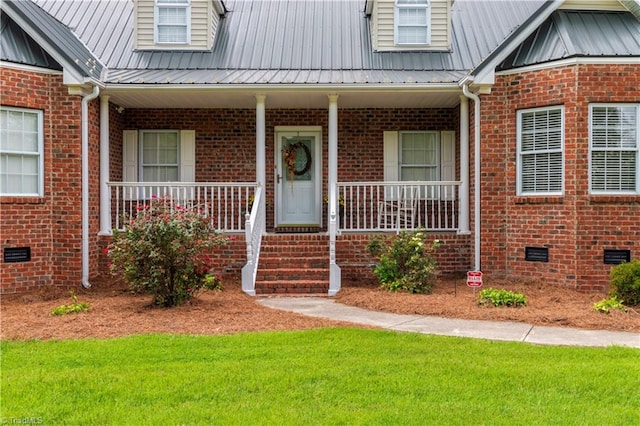 doorway to property with covered porch