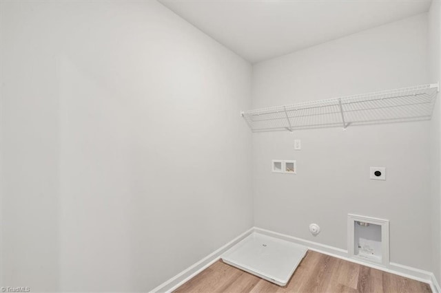 laundry area featuring gas dryer hookup, hookup for an electric dryer, hookup for a washing machine, and hardwood / wood-style flooring