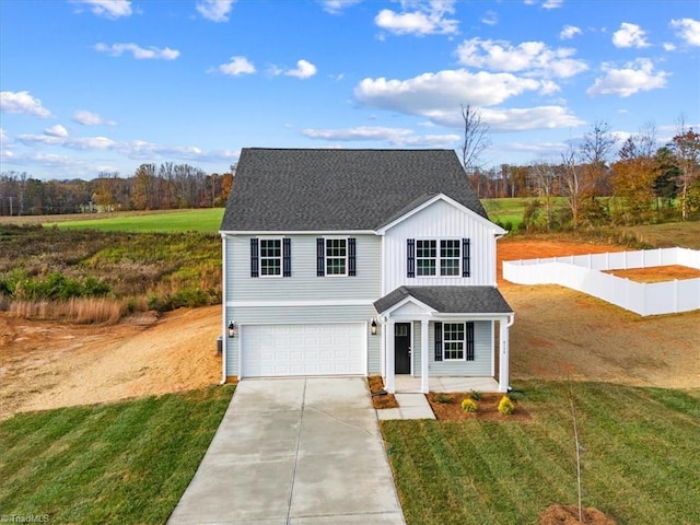 view of front of house featuring a garage and a front lawn