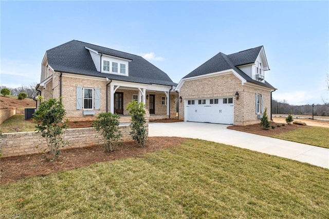 view of front of home featuring a front lawn, an attached garage, brick siding, and driveway