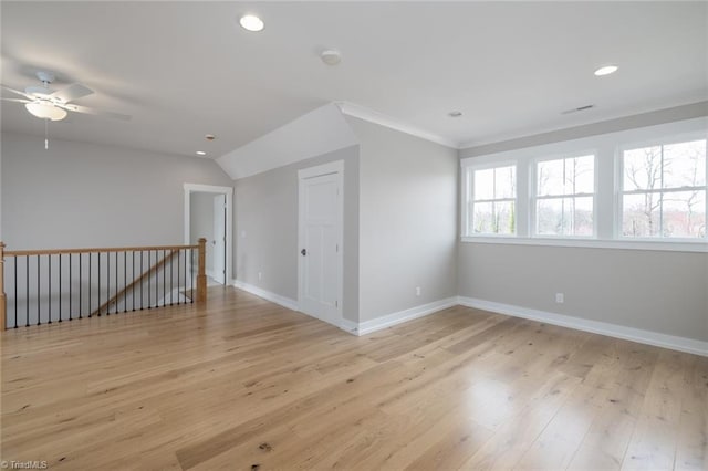 spare room featuring recessed lighting, light wood-style flooring, a ceiling fan, and baseboards