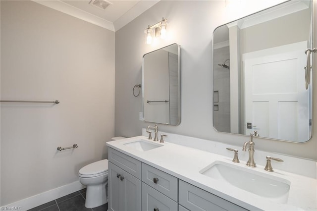 bathroom with tile patterned floors, visible vents, toilet, and a sink