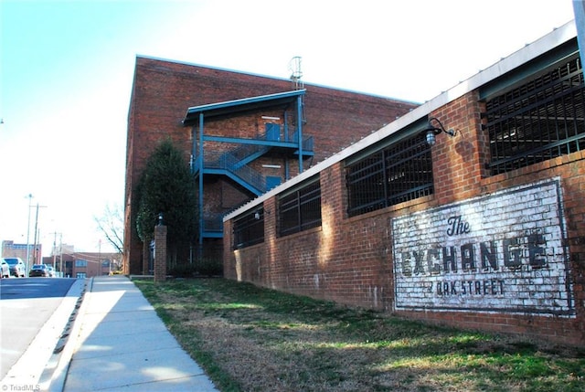 view of home's exterior with brick siding