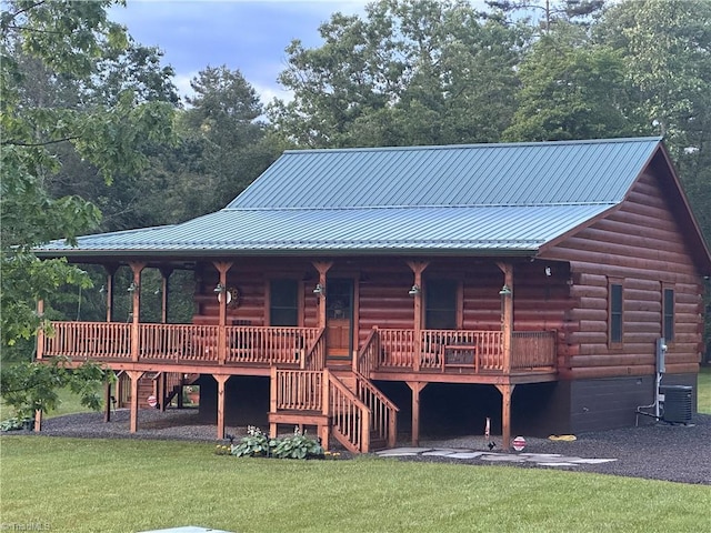 45 Wedgewood Ridge Ln, Fancy Gap, VA 24328 - view of front of house with log siding, stairs, a porch, and a front lawn