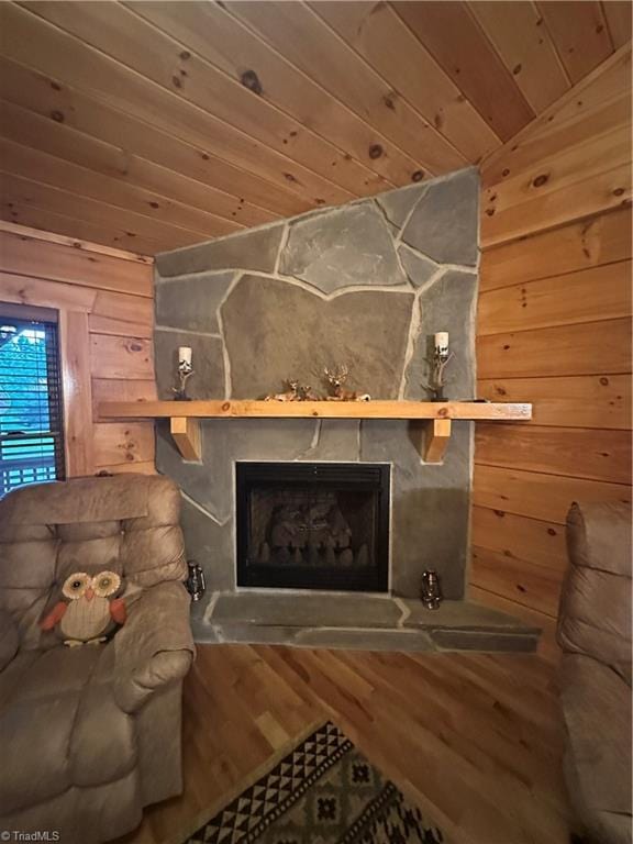 45 Wedgewood Ridge Ln, Fancy Gap, VA 24328 - living room featuring wood ceiling, a fireplace, wooden walls, wood finished floors, and vaulted ceiling