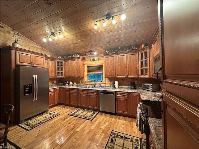 45 Wedgewood Ridge Ln, Fancy Gap, VA 24328 - kitchen featuring appliances with stainless steel finishes, brown cabinetry, light wood finished floors, vaulted ceiling, and wood ceiling