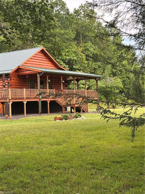 45 Wedgewood Ridge Ln, Fancy Gap, VA 24328 - rear view of property with a yard, log siding, metal roof, and stairway