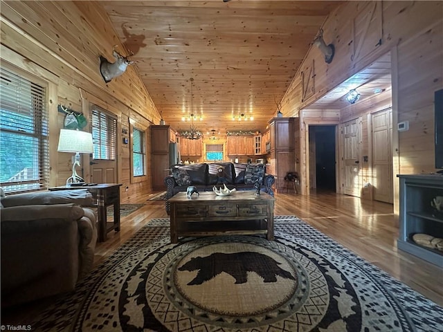 45 Wedgewood Ridge Ln, Fancy Gap, VA 24328 - living area featuring wood walls, wood finished floors, vaulted ceiling, and wooden ceiling
