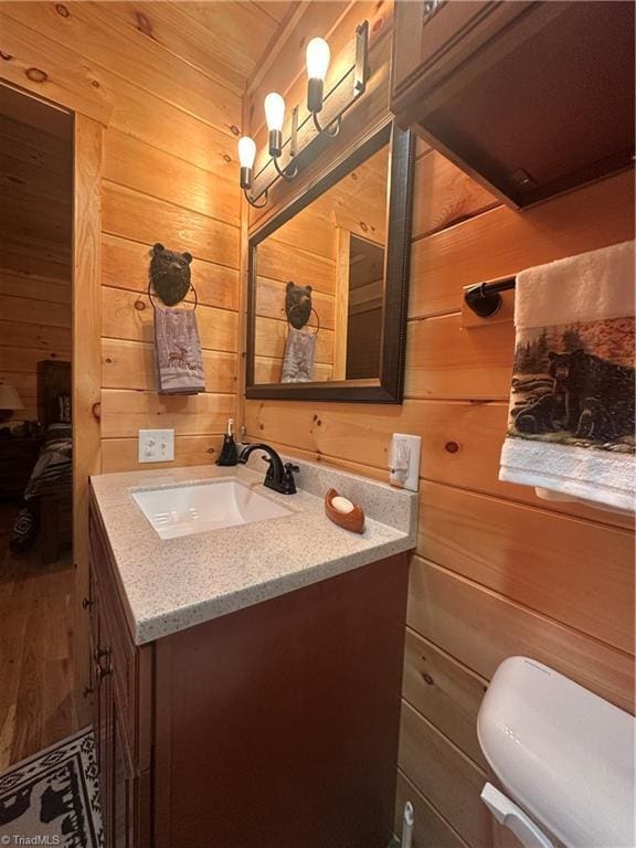 45 Wedgewood Ridge Ln, Fancy Gap, VA 24328 - bathroom with vanity, wood walls, wood finished floors, and toilet