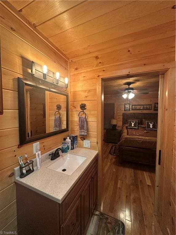 45 Wedgewood Ridge Ln, Fancy Gap, VA 24328 - bathroom with wooden walls, hardwood / wood-style flooring, vanity, wood ceiling, and a ceiling fan