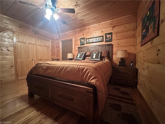 45 Wedgewood Ridge Ln, Fancy Gap, VA 24328 - bedroom with wood finished floors, wood walls, wood ceiling, and ceiling fan