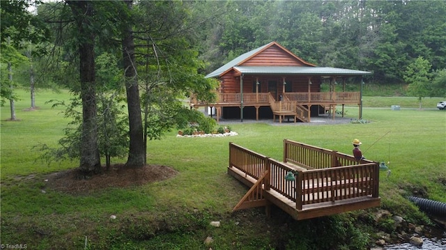 45 Wedgewood Ridge Ln, Fancy Gap, VA 24328 - back of house featuring a lawn, log siding, and a wooden deck