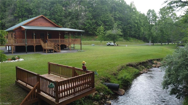 45 Wedgewood Ridge Ln, Fancy Gap, VA 24328 - view of green lawn featuring a deck, stairway, and a forest view