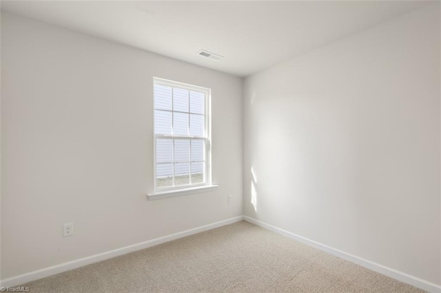 empty room featuring carpet flooring