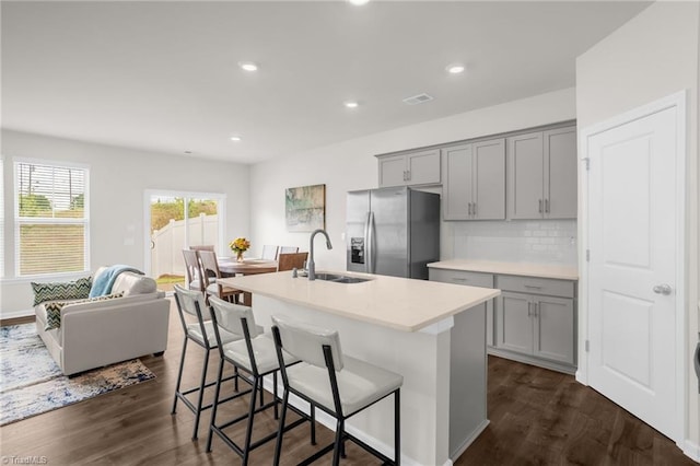 1230 Evelynnview Ln, Kernersville, NC 27284 - kitchen featuring stainless steel refrigerator with ice dispenser, gray cabinets, a sink, a kitchen breakfast bar, and recessed lighting