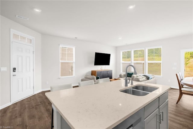 1230 Evelynnview Ln, Kernersville, NC 27284 - kitchen with a sink, dark wood-type flooring, light stone countertops, recessed lighting, and open floor plan