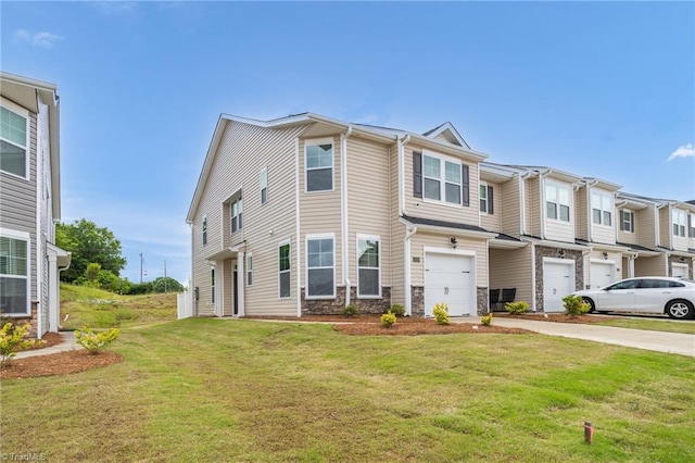 1230 Evelynnview Ln, Kernersville, NC 27284 - view of property featuring stone siding, concrete driveway, a garage, and a front lawn