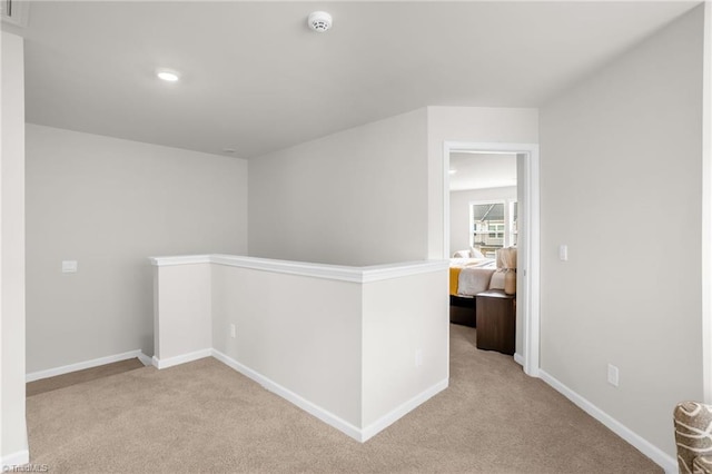1230 Evelynnview Ln, Kernersville, NC 27284 - hall with an upstairs landing, light colored carpet, baseboards, and recessed lighting