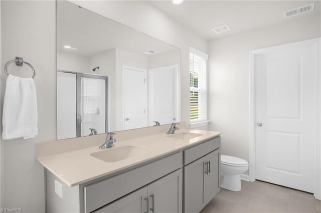 1230 Evelynnview Ln, Kernersville, NC 27284 - bathroom with double vanity, toilet, a stall shower, and recessed lighting