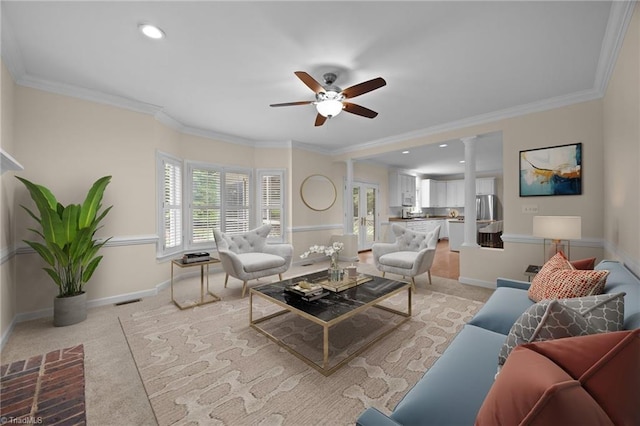 1400 Covered Wagon Rd, Mcleansville, NC 27301 - living room with a ceiling fan, ornate columns, baseboards, light colored carpet, and crown molding