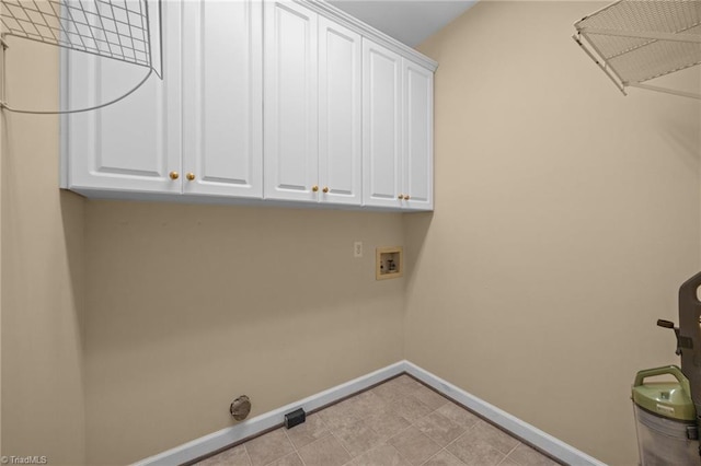 1400 Covered Wagon Rd, Mcleansville, NC 27301 - clothes washing area with baseboards, washer hookup, and cabinet space