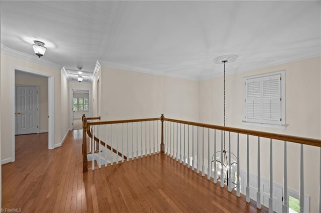 1400 Covered Wagon Rd, Mcleansville, NC 27301 - hall featuring an upstairs landing, wood finished floors, and ornamental molding