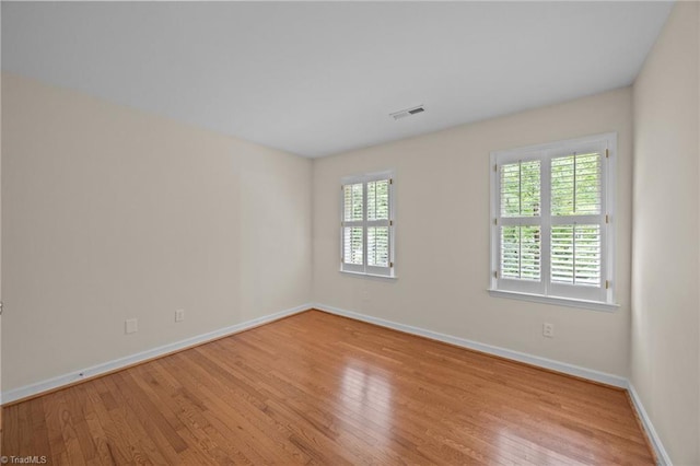 1400 Covered Wagon Rd, Mcleansville, NC 27301 - spare room with wood finished floors and baseboards
