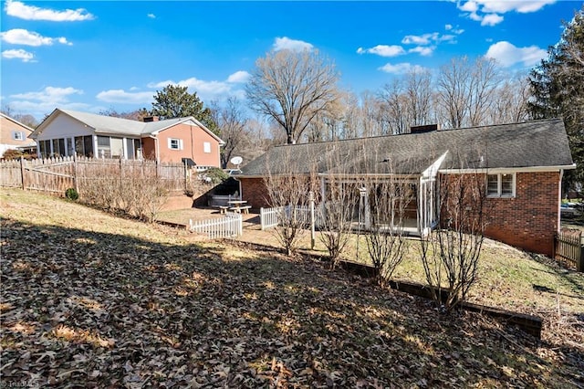 view of yard featuring a sunroom