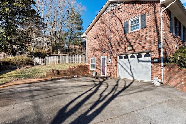 view of property exterior featuring a garage